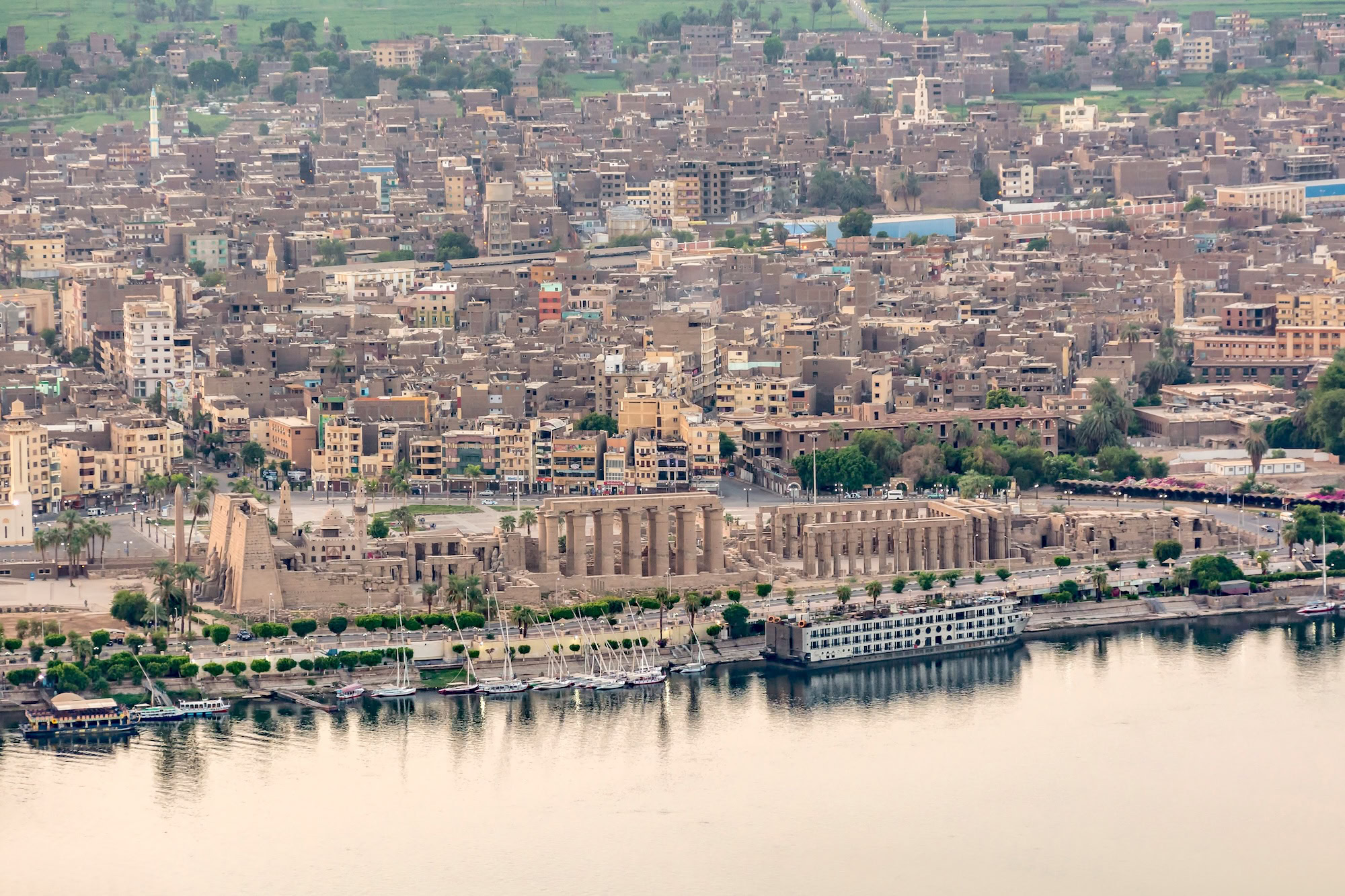 Luxor Egypt 08 20 2017 Aerial view of the Luxor Temple and Nile river at sunrise 2
