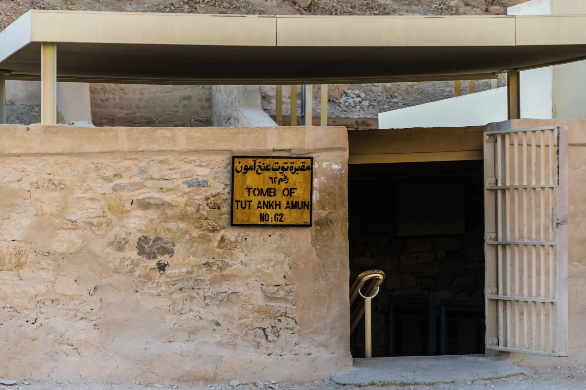 Entrance to King Tutankhamun's tomb in the Valley of the Kings with protective shelter and signage