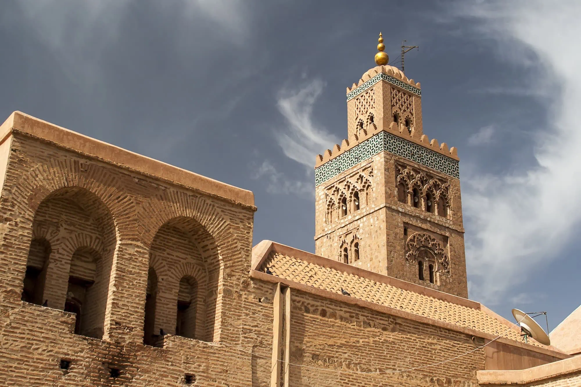 Koutoubia Mosque minaret with traditional Moroccan Islamic architecture and ornate geometric patterns
