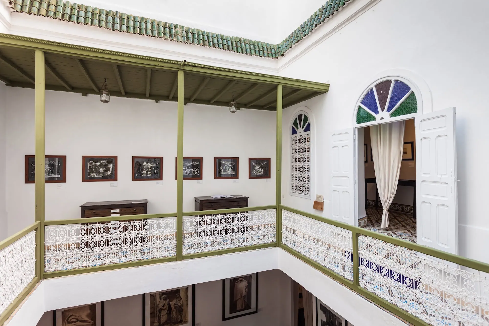 Interior courtyard of Photography Museum of Marrakesh with framed photographs on white walls