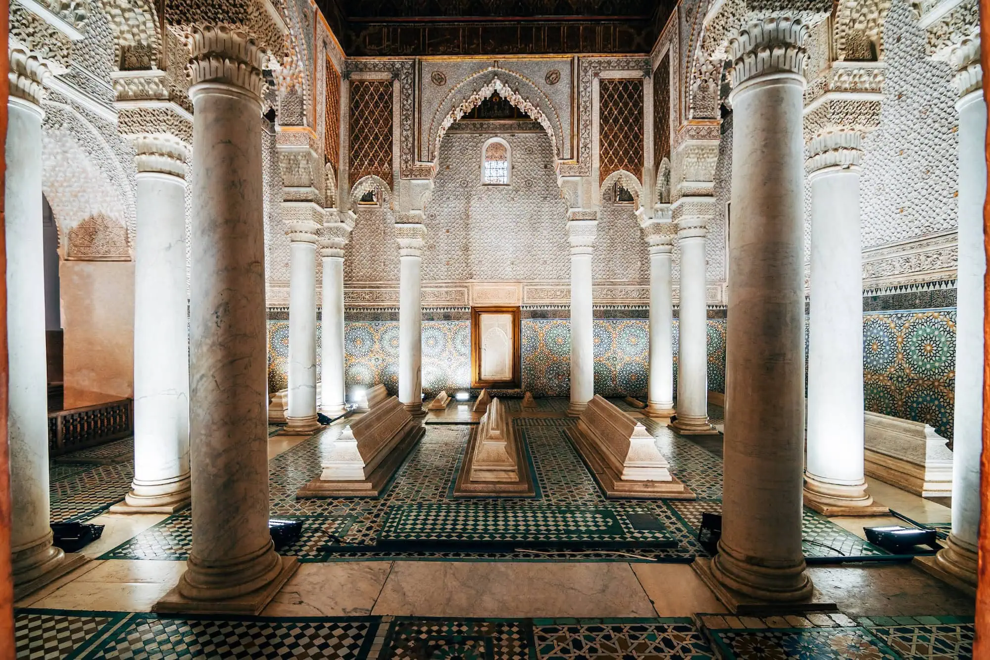 Interior of Saadian Tombs showing ornate Moorish architecture with marble columns and geometric tilework