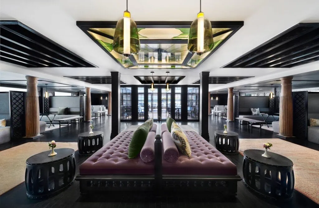 The spacious main lobby aboard the Mövenpick MS Darakum, with seating arrangements, decorative lighting, classical Egyptian and oriental design elements, and polished surfaces.