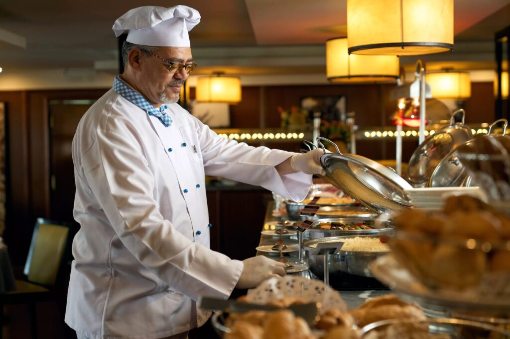 Chef arranging a buffet table