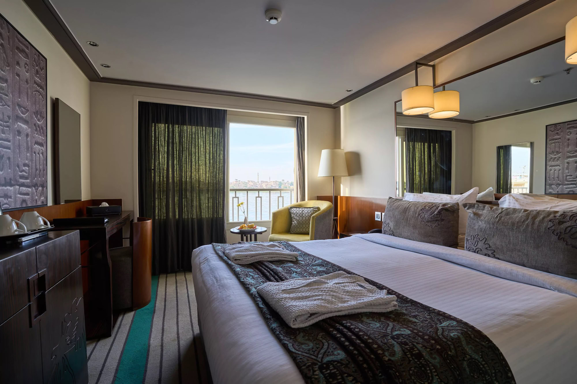 Luxurious hotel room with elegant bedding and sophisticated interior design