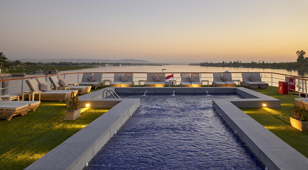 Outdoor pool on Mövenpick Royal Lily with sun loungers