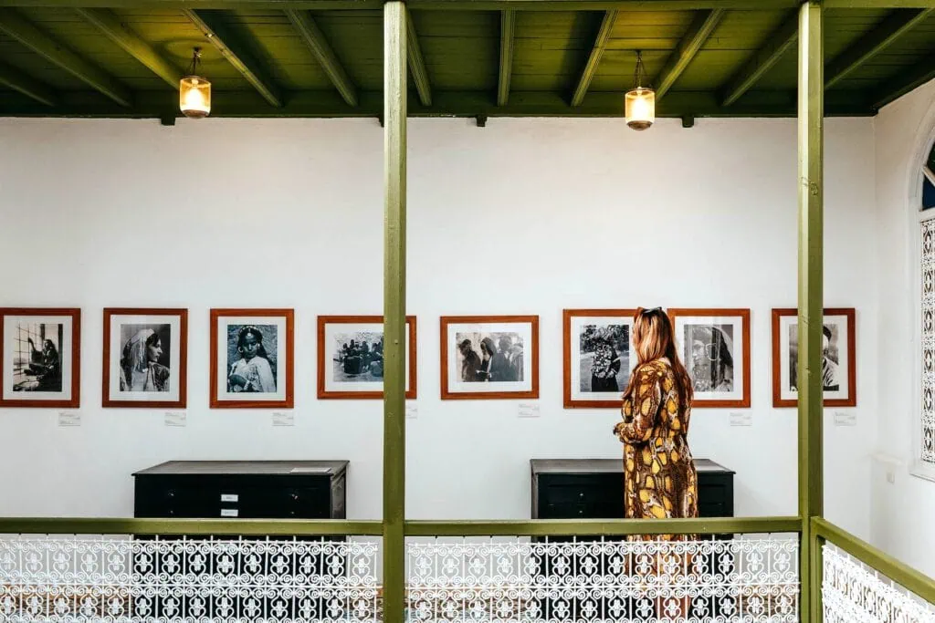 House of Photography interior gallery with framed black-and-white portraits displayed along white walls Marrakech