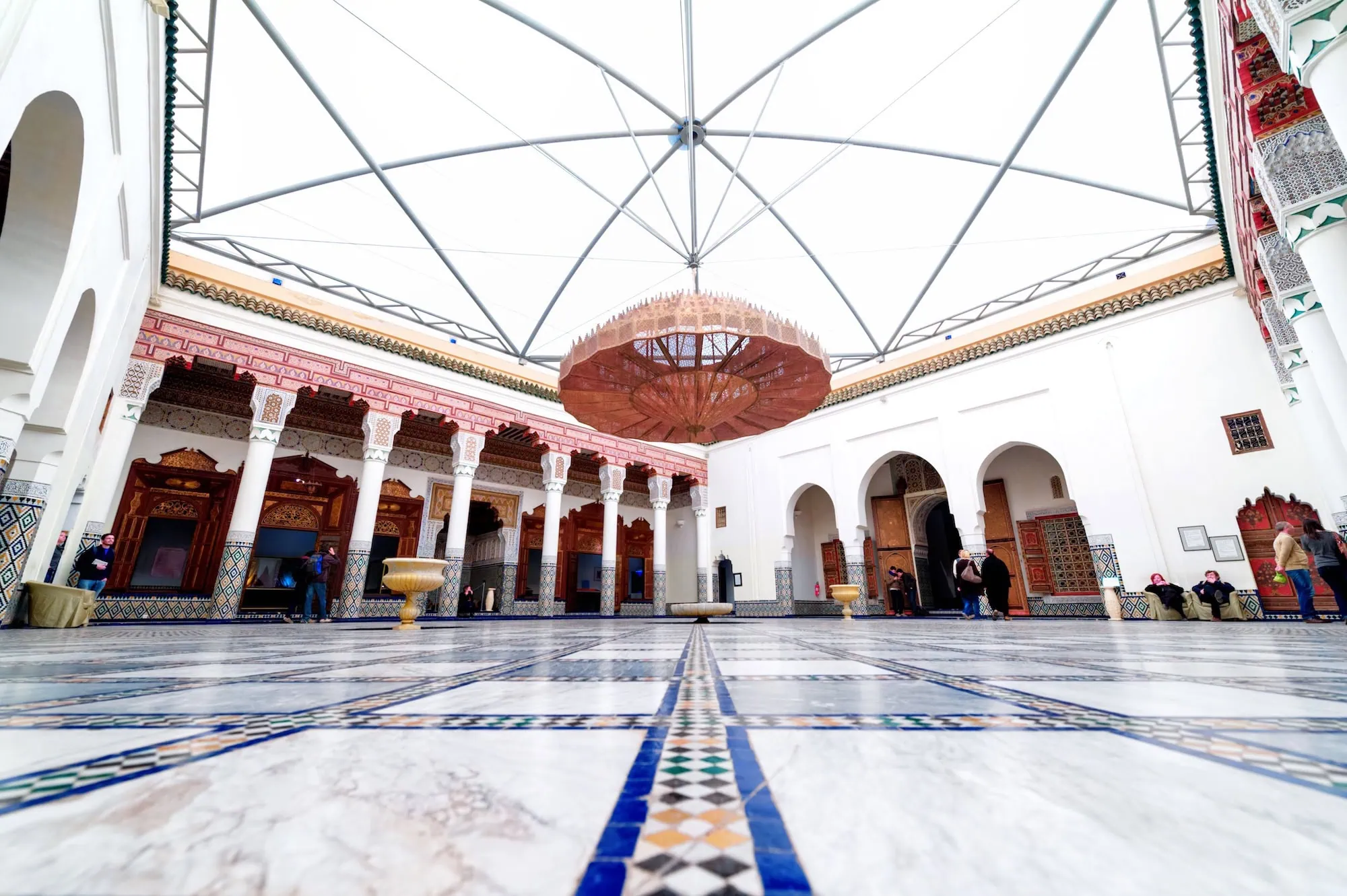 Interior courtyard of Marrakech Museum with traditional Moroccan architecture and visitors