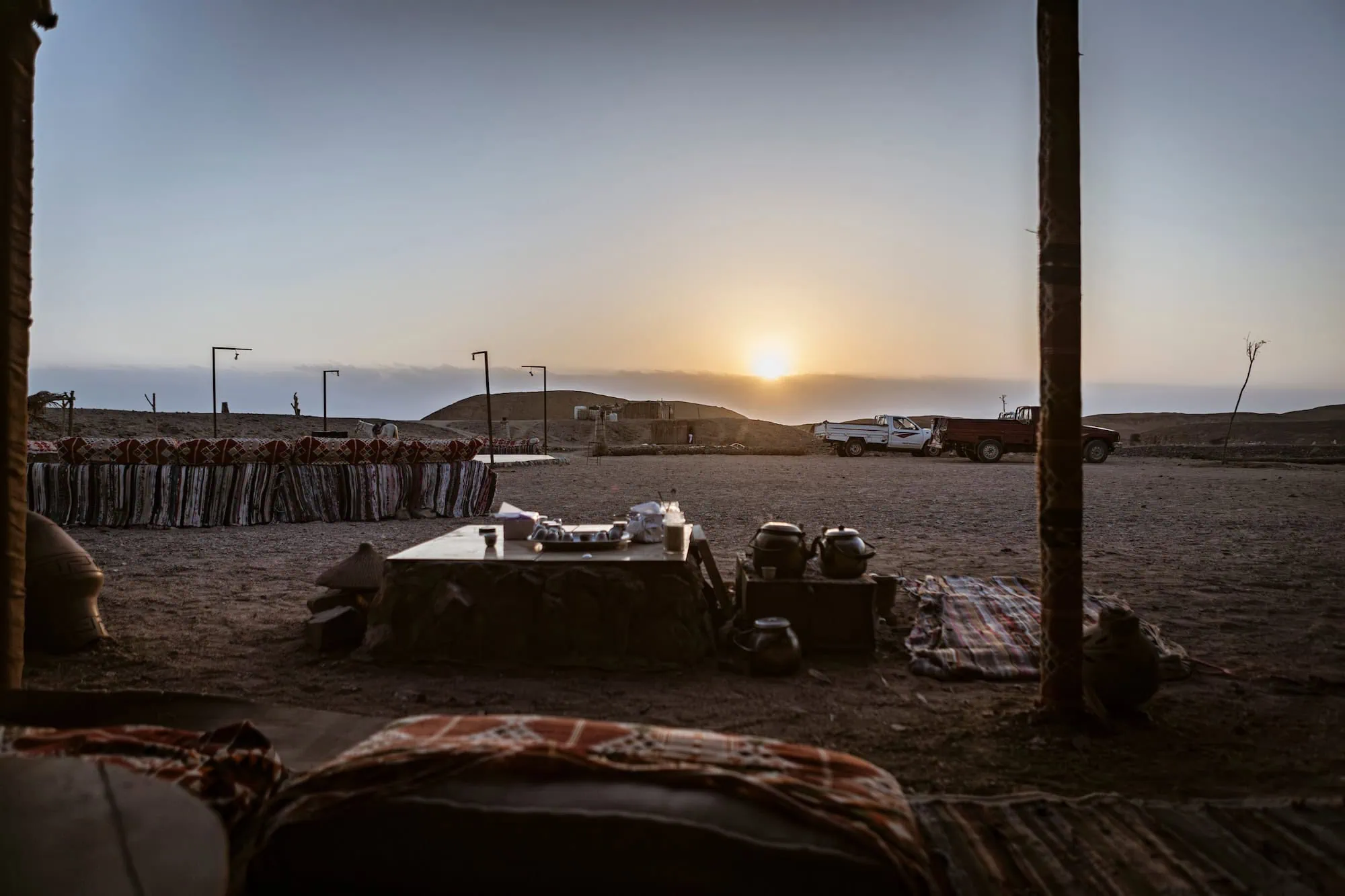 Traditional desert camp with tent and camp setup in serene desert landscape