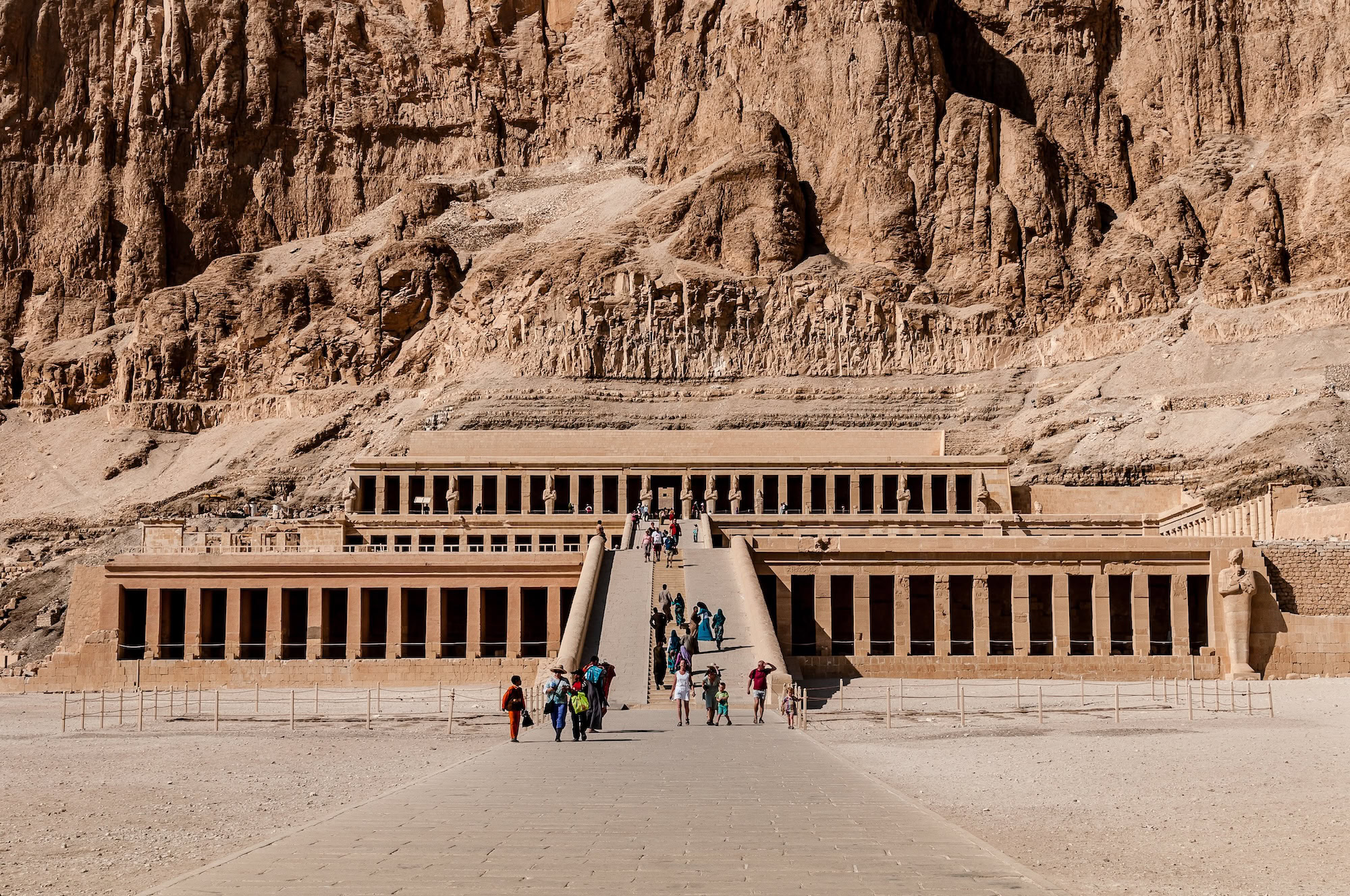 Ancient Temple of Hatshepsut with terraced limestone architecture against dramatic cliffs
