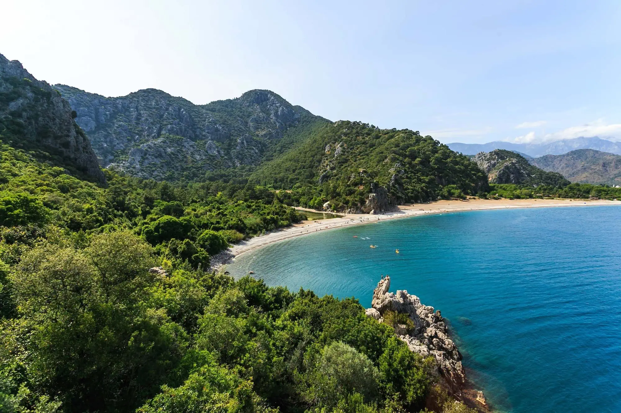 Aerial view of Mount Olympos with turquoise Mediterranean coast and forested mountains
