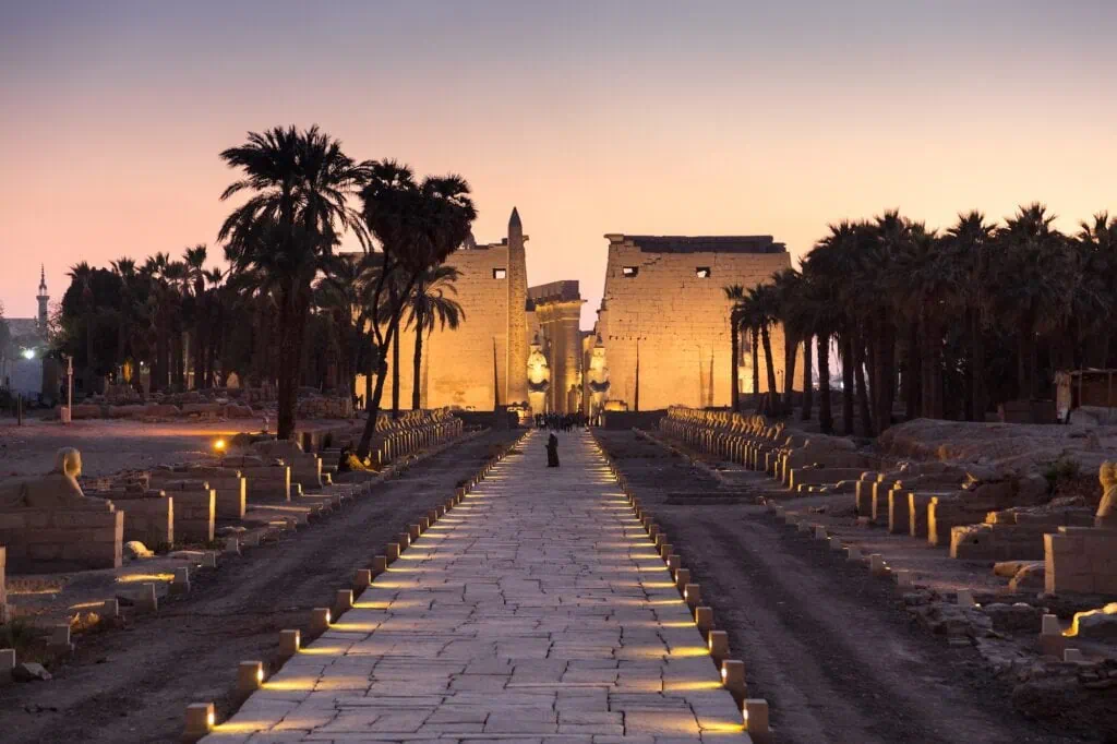 Night view of the illuminated Avenue of Sphinxes at Luxor Temple