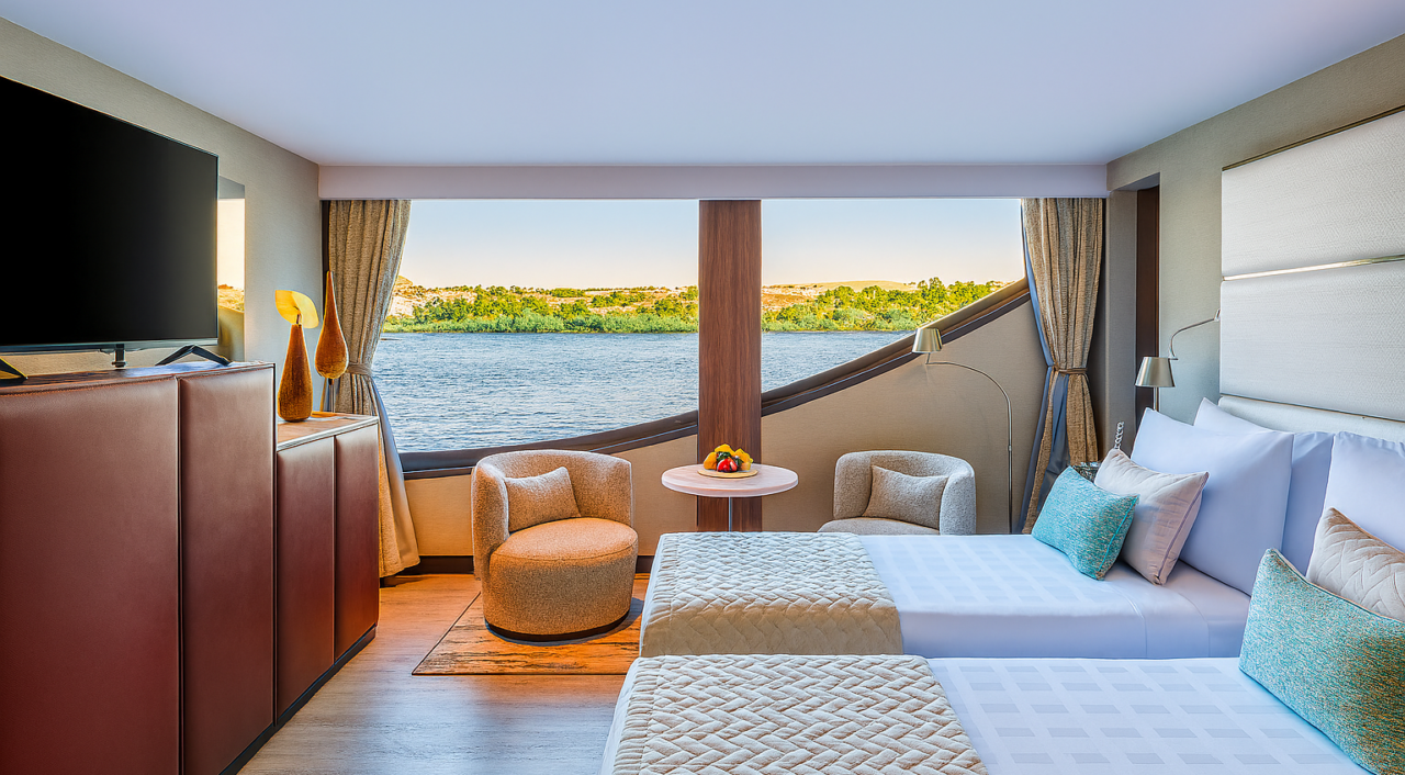 Oberoi Zahra suite bedroom featuring soft linens and river view