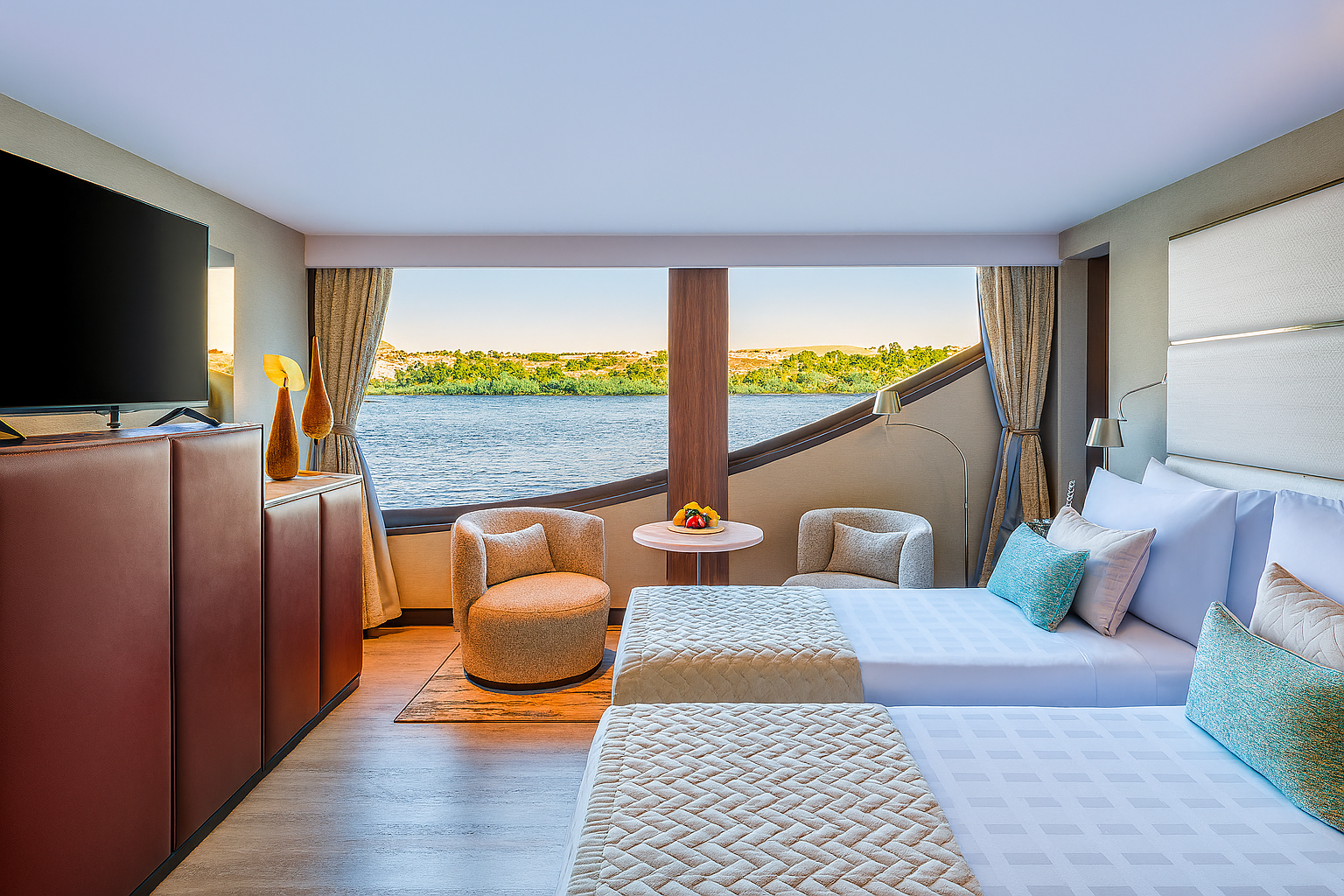 Oberoi Zahra suite bedroom featuring soft linens and river view