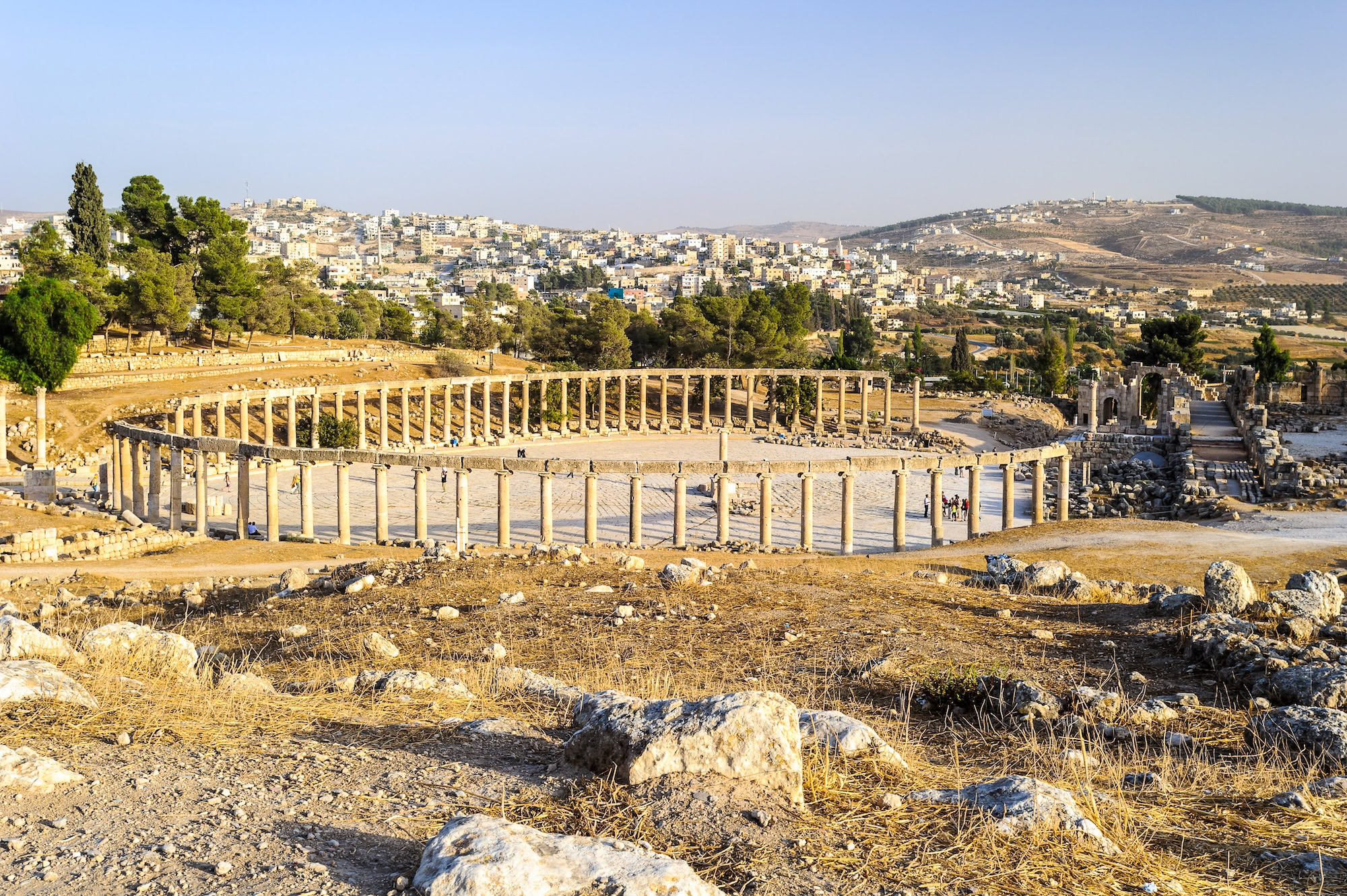 Ancient Roman ruins of Jerash with oval plaza and towering columns in Jordan