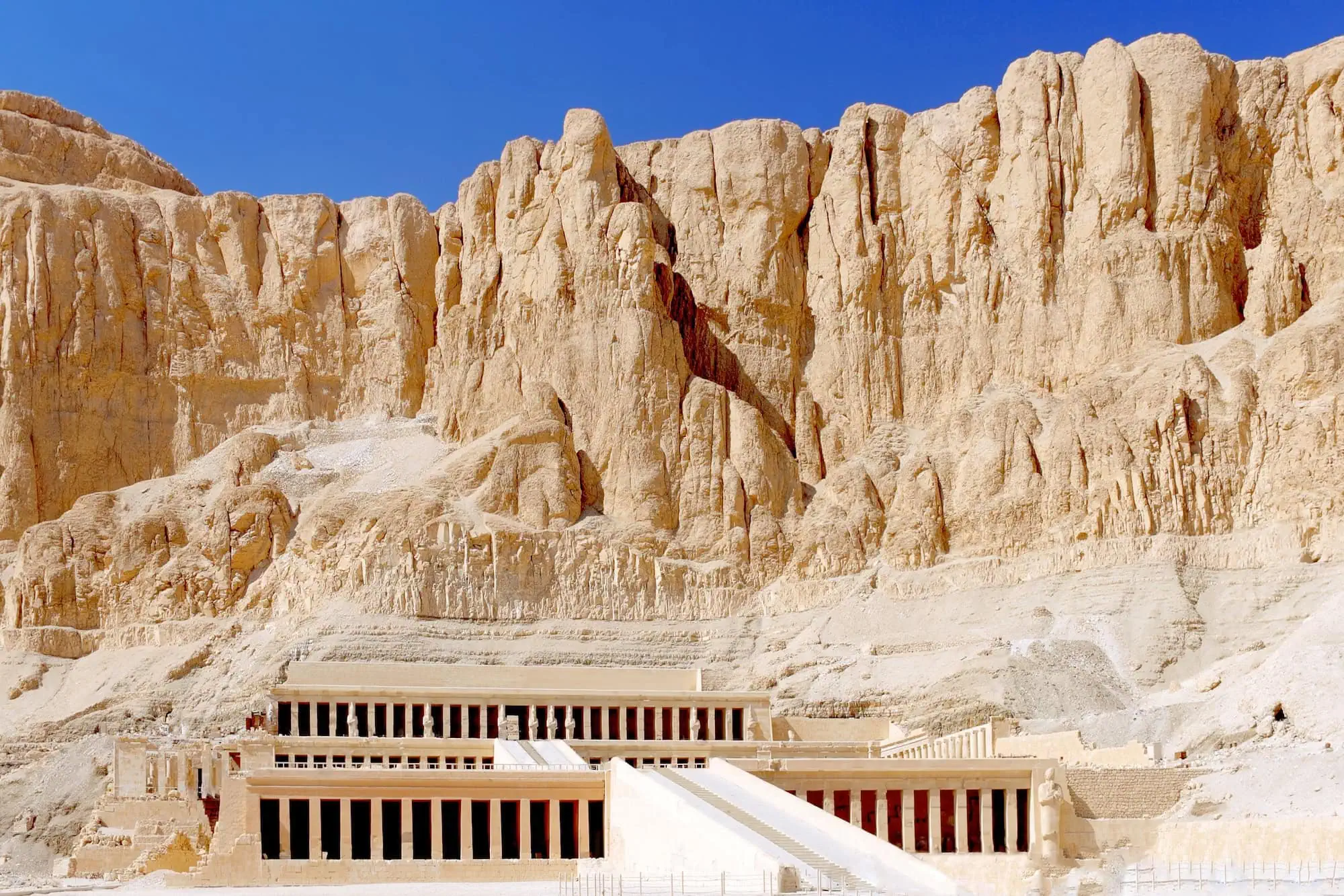 Temple of Hatshepsut with terraced limestone architecture against desert cliffs