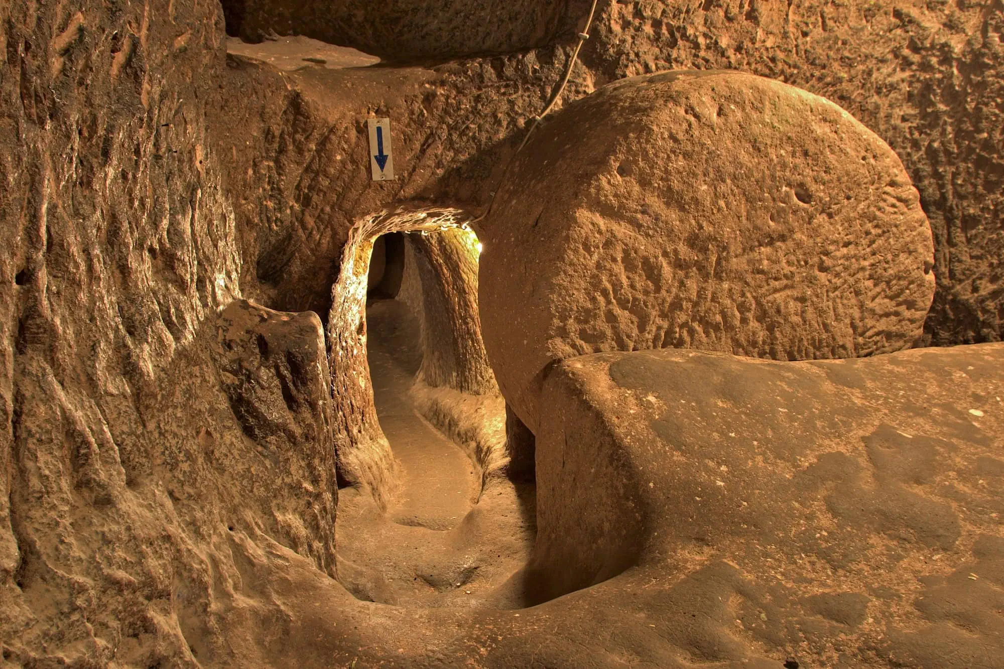 Interior view of carved stone underground tunnels and passages with arched doorways