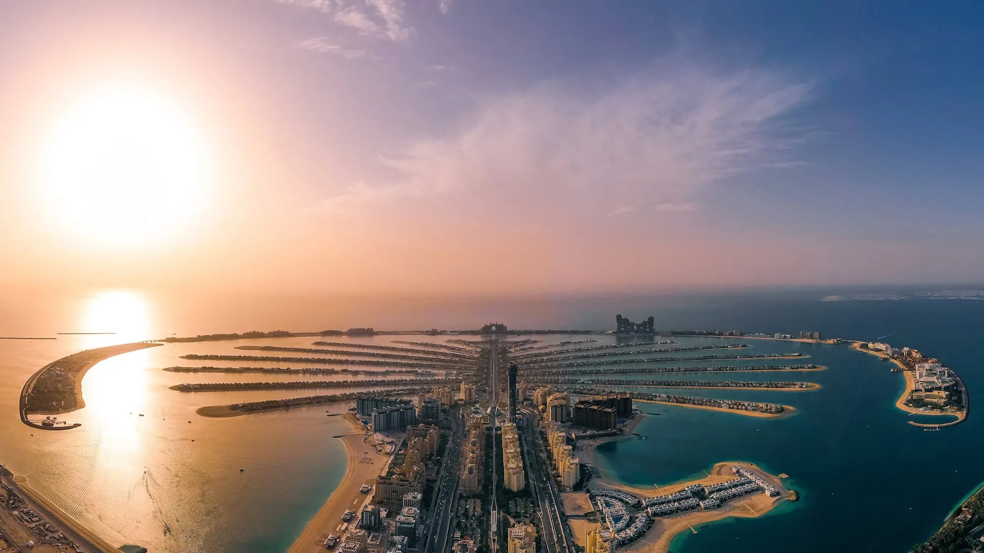 Aerial view of Palm Jumeirah artificial island in Dubai at sunset