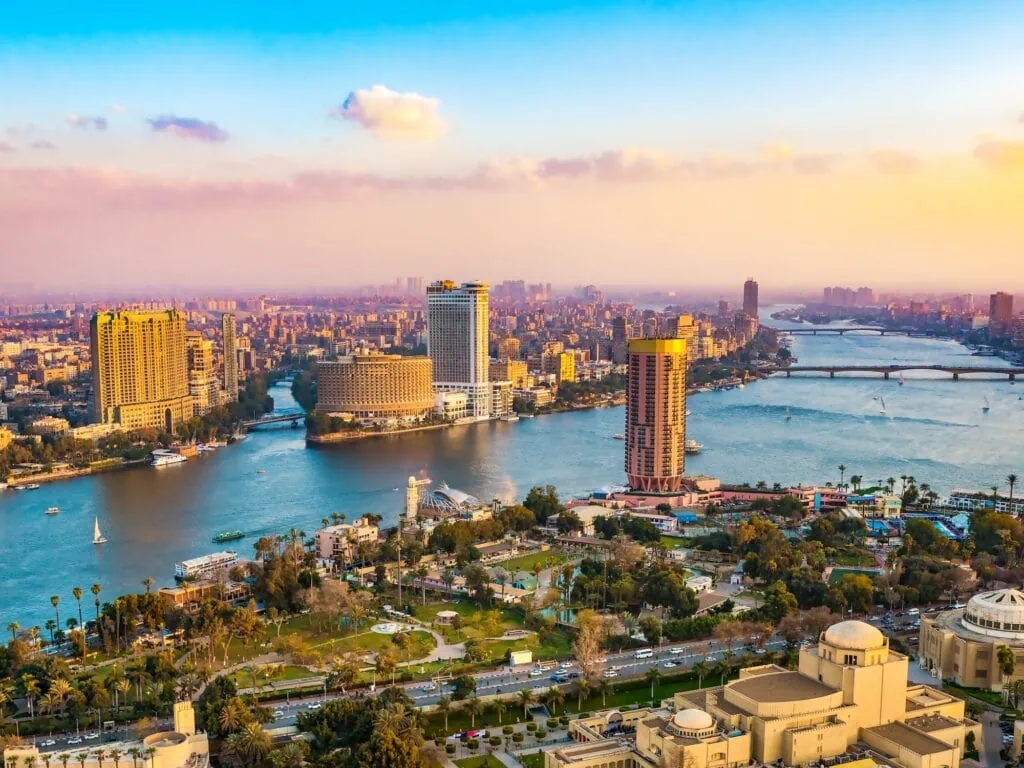 Panoramic view of the Cairo cityscape at sunset from the observation deck of the Cairo Tower, looking out over the Nile and the city, Egypt.