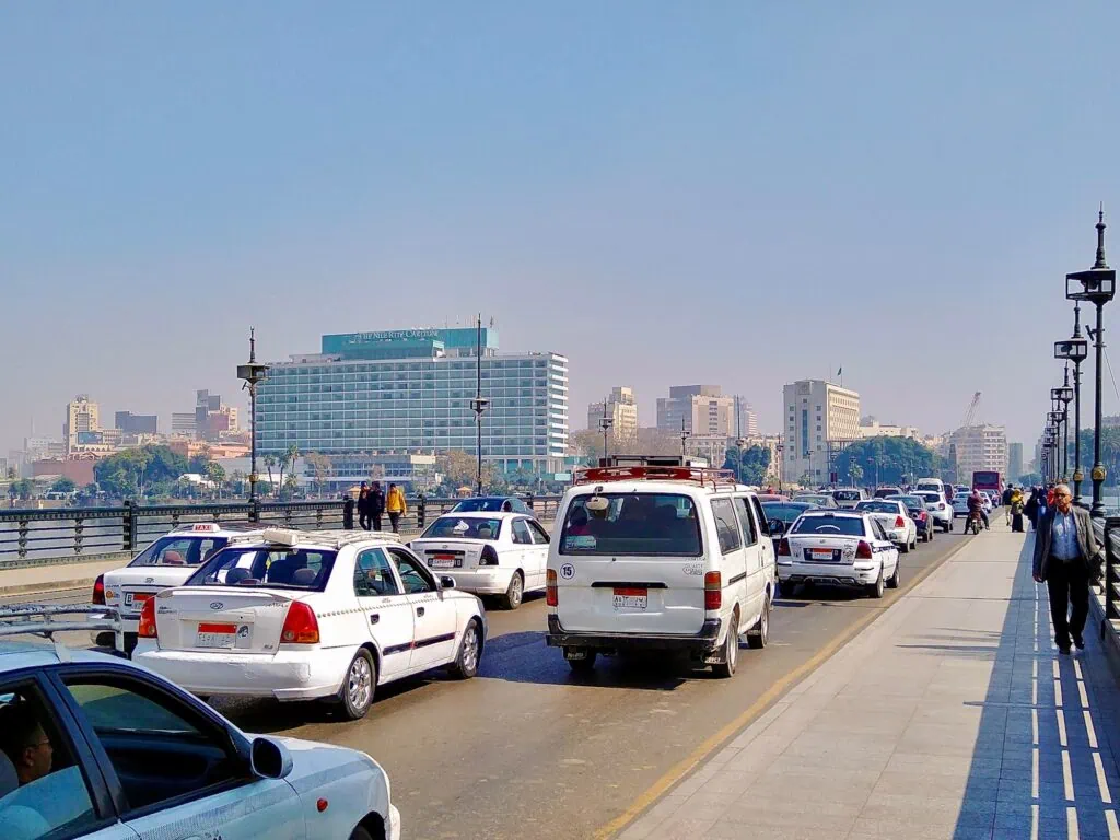 Heavy traffic crossing Qasr El Nil Bridge with vehicles lined along the Nile River, Qasr El Nil Bridge, Cairo