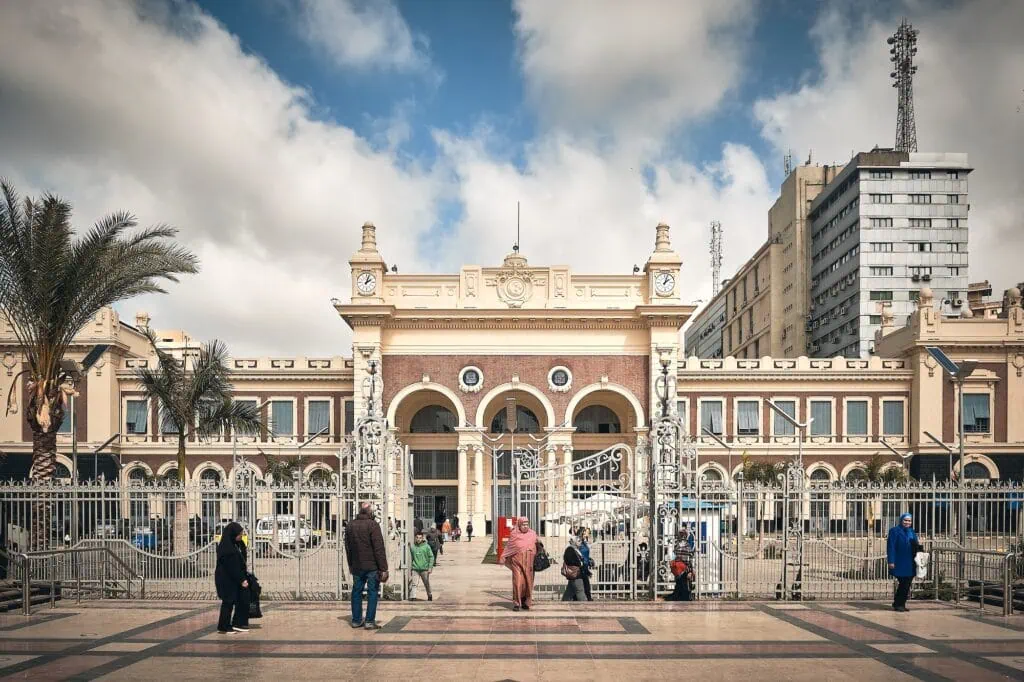 People gathered at Station Square in front of Alexandria Railway Station building, Alexandria