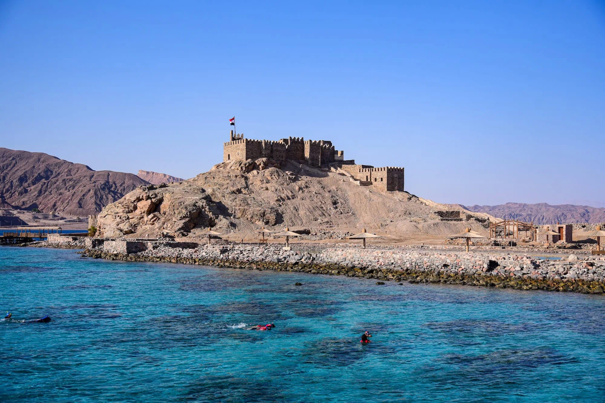 Medieval fortress of Saladin on rocky island surrounded by turquoise waters