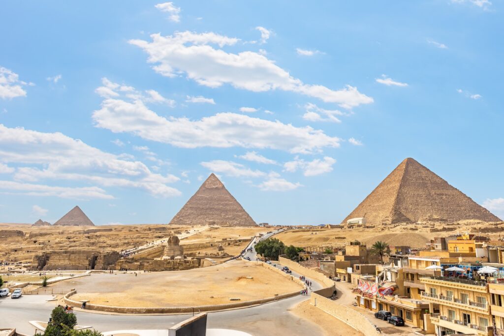 Pyramids and Sphinx on Giza plateau in desert of Egypt view from above