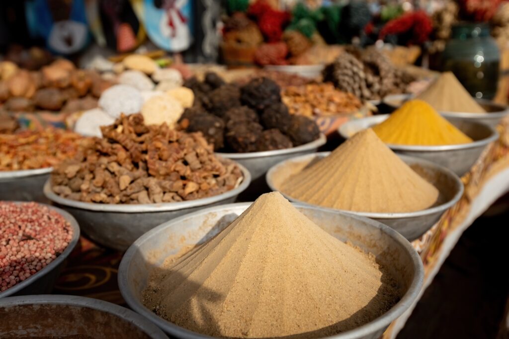 Colorful spice pyramids and powdered spices at Egyptian market