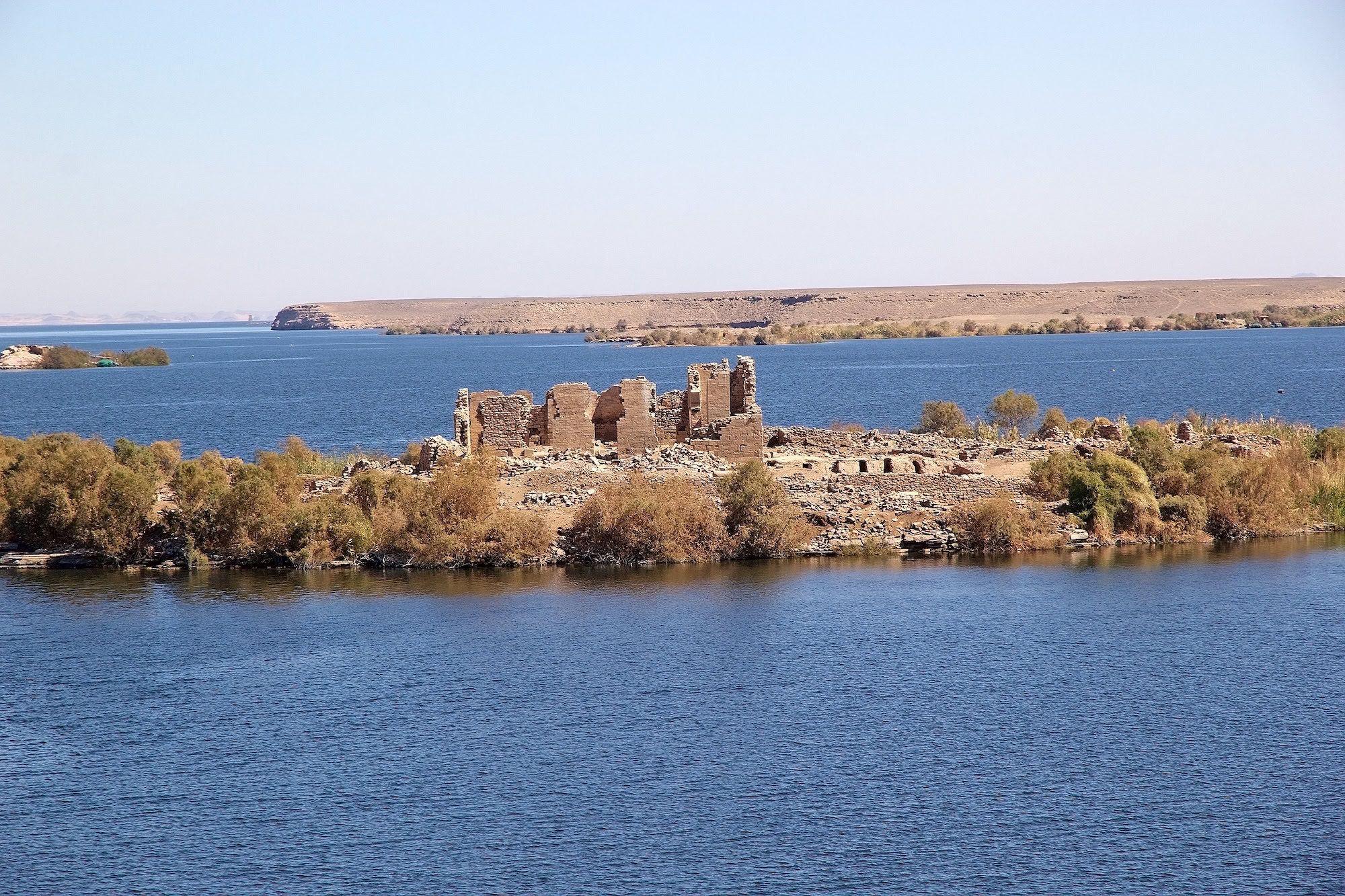 Ancient Kalabsha Temple ruins on an island surrounded by water before relocation