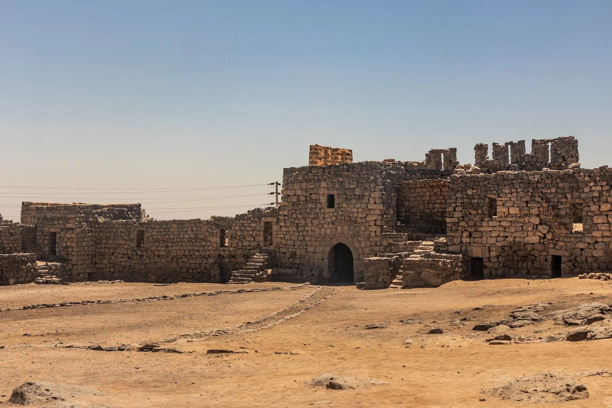 Ancient stone fortress ruins of Qasr al-Azraq in Jordan's desert