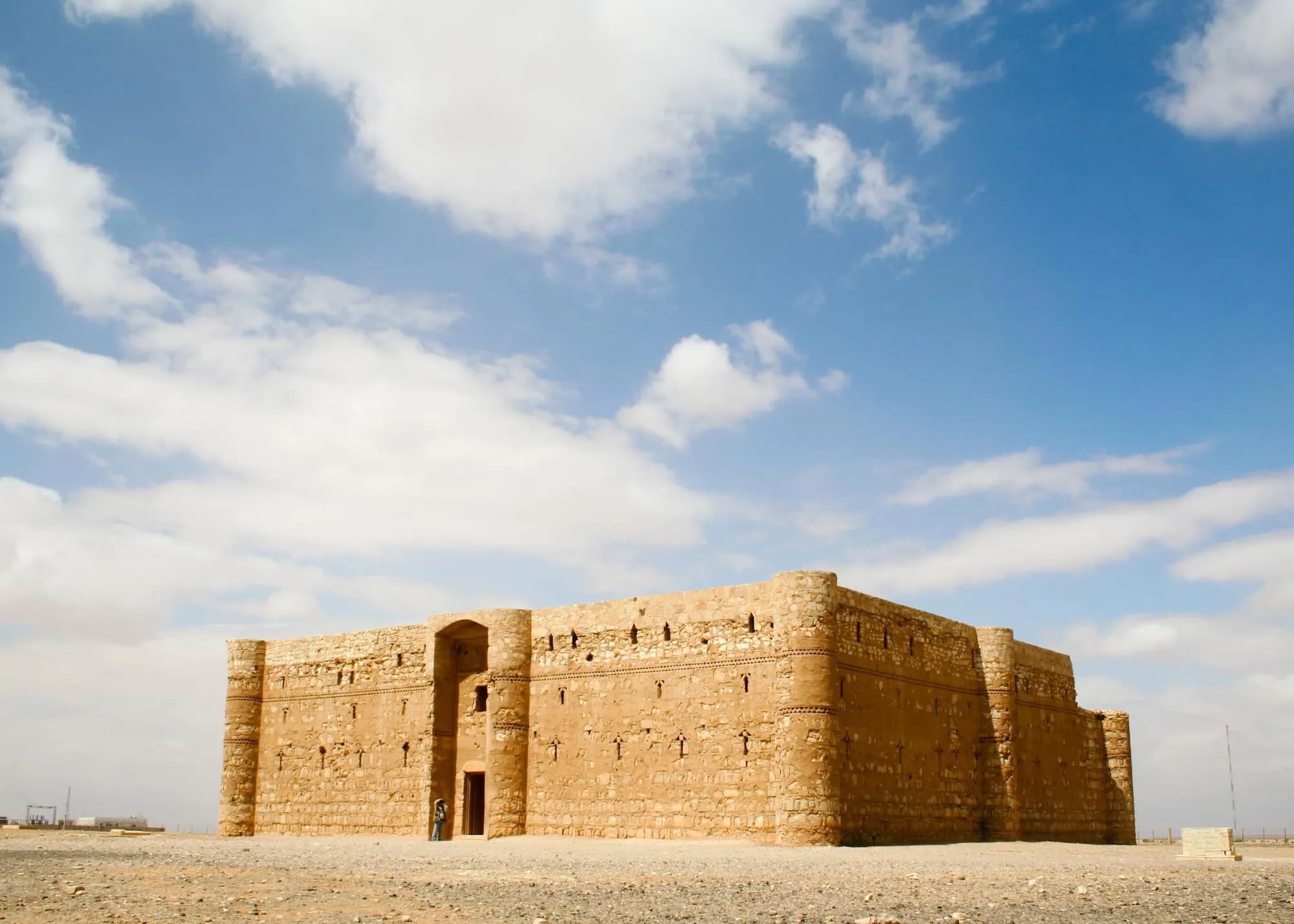 Ancient Qasr al-Kharanah desert fortress standing in Jordan's arid landscape
