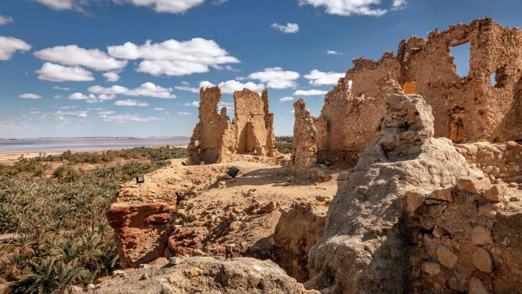 Ruins of the Temple of the Oracle surrounded by desert landscape in Siwa Oasis