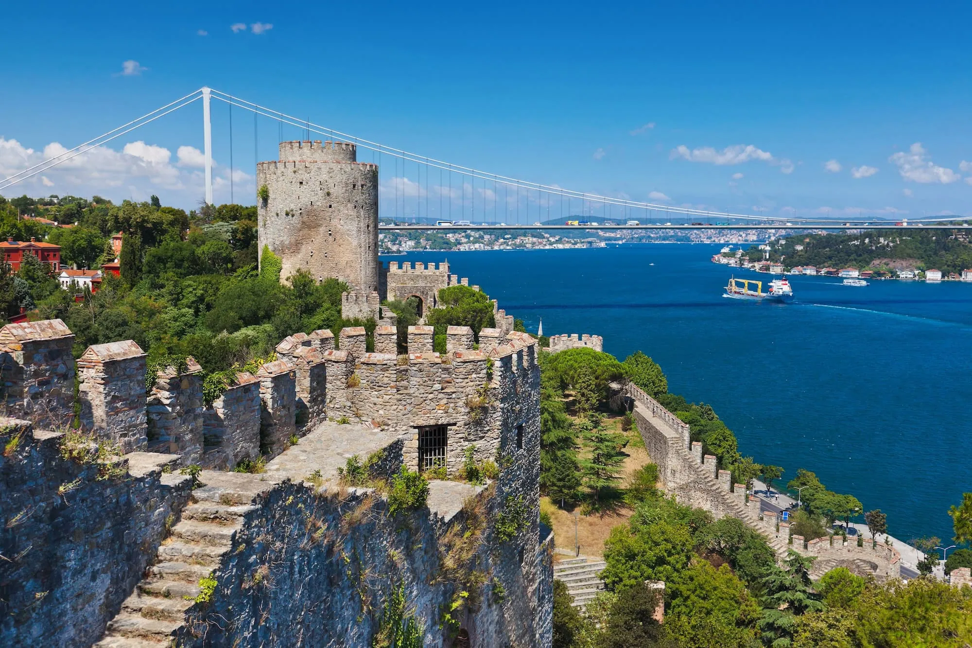 Historic Rumeli Fortress with stone walls and cylindrical tower overlooking Bosphorus strait
