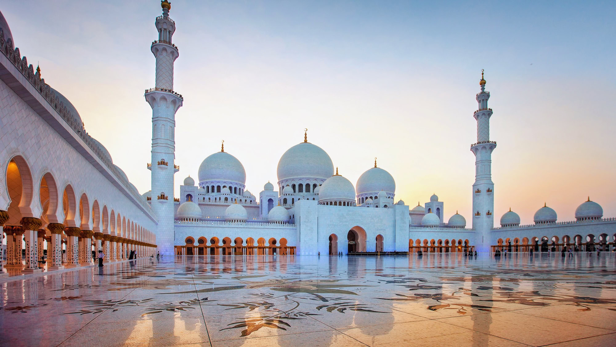 Sheikh Zayed Grand Mosque in Abu Dhabi with white marble courtyard and Islamic architecture