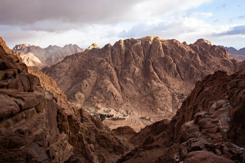 View of Mount Sinai and the surrounding Sinai mountain range in southern Egypt under a cloudy sky