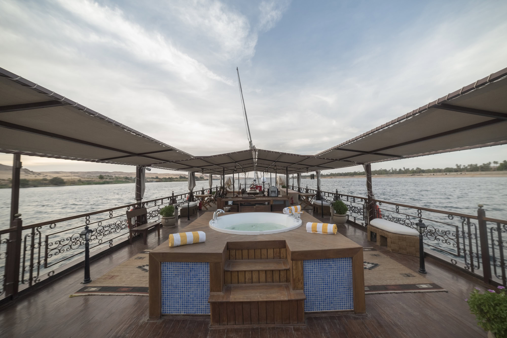 Luxury Nile River cruise ship deck with hot tub and seating area