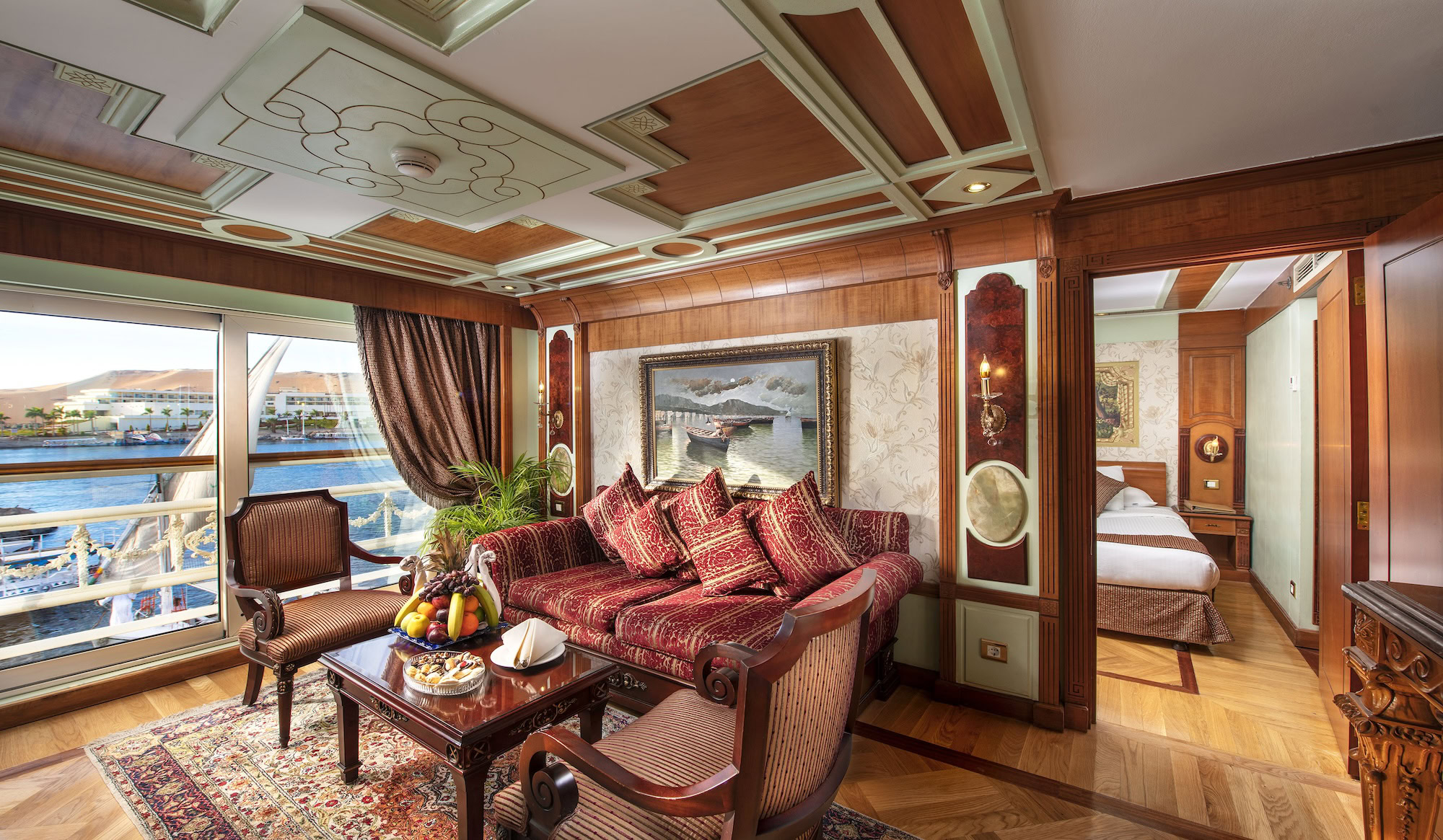 Luxurious Nile cruise ship cabin interior with comfortable seating and river view