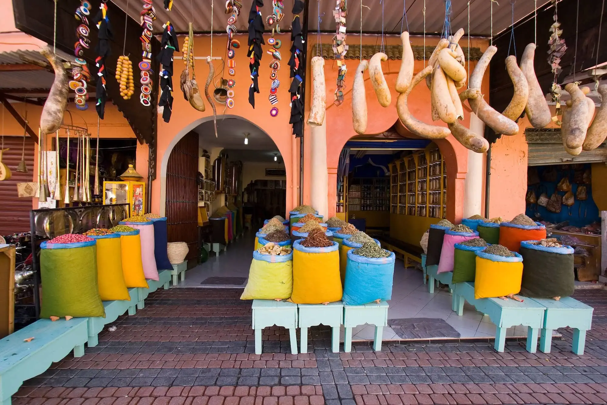 Colorful spice shop in traditional Moroccan souk with vibrant spices displayed in large sacks