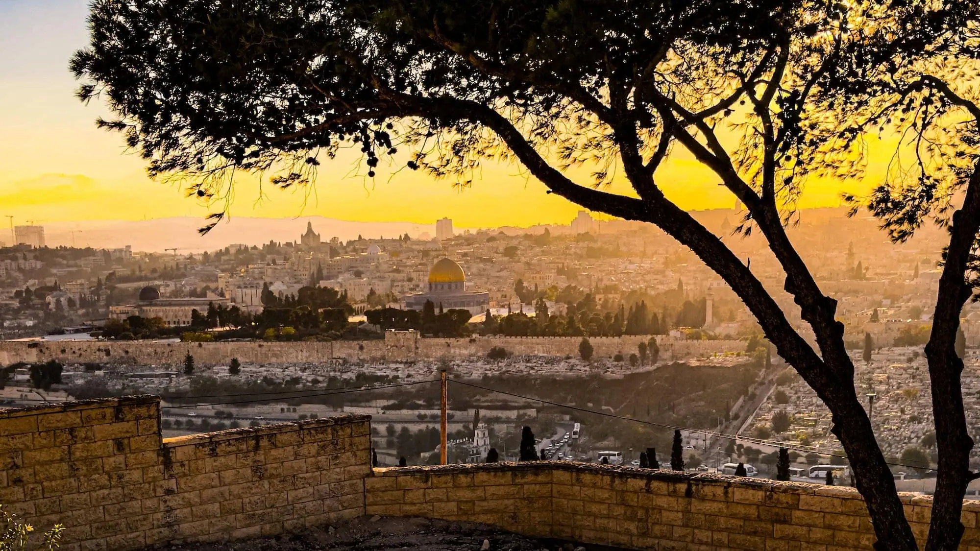 Sunset view over Jerusalem's Old City with the golden Dome of the Rock