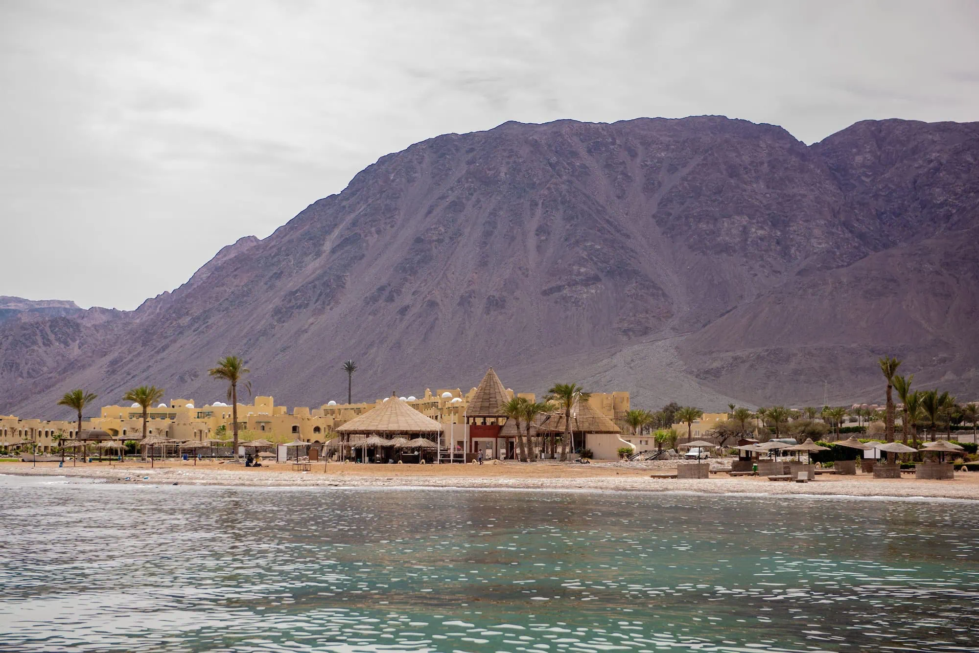 Coastal landscape of Taba at Gulf of Aqaba with turquoise waters and desert mountains