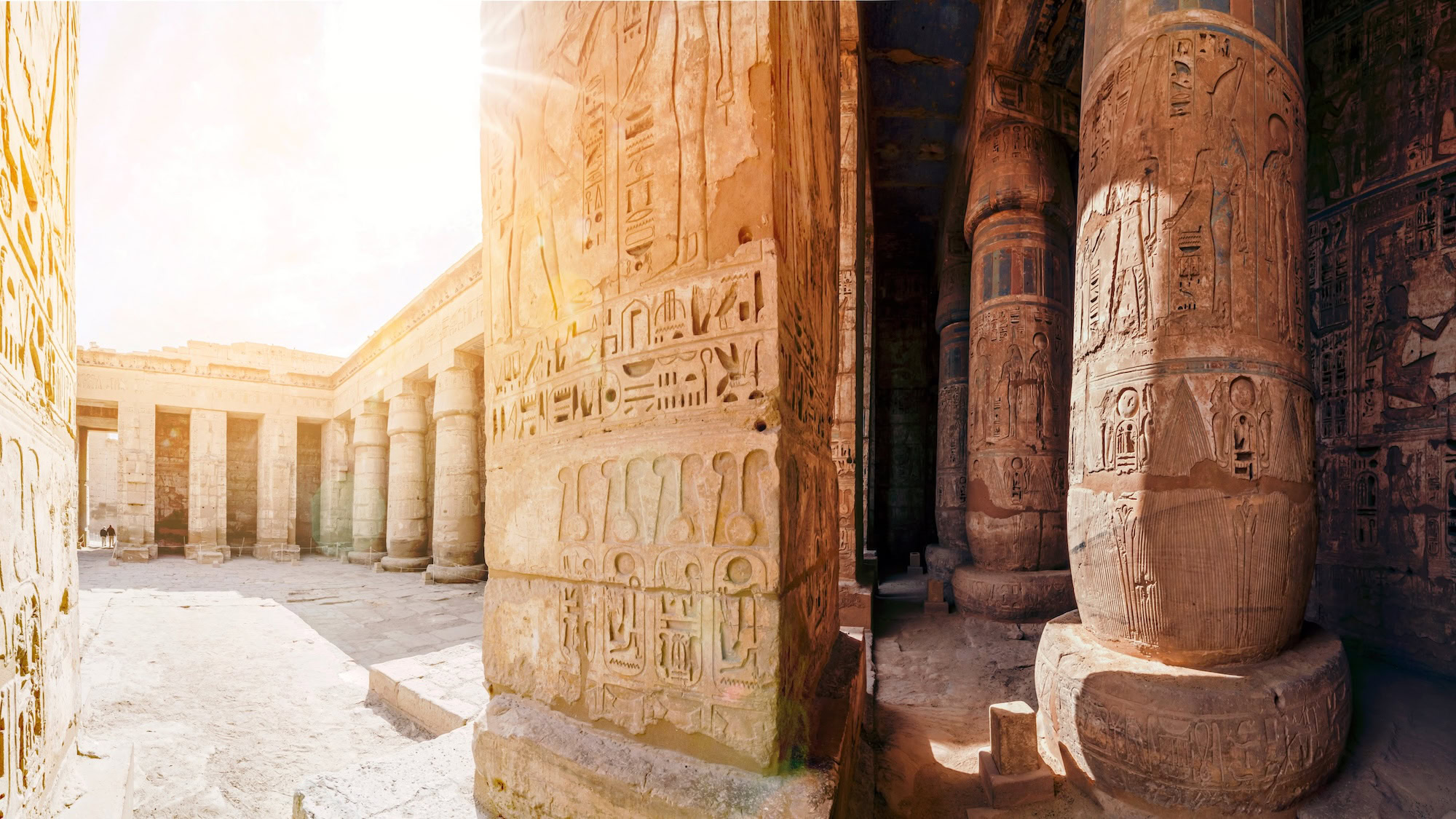 Ancient Egyptian temple with hieroglyphic carvings and stone columns