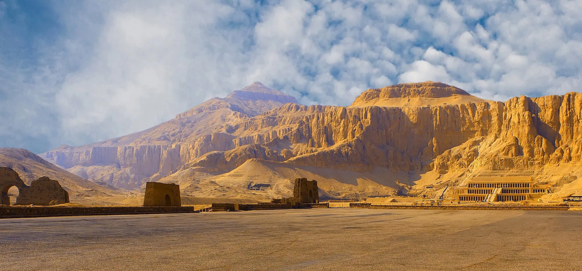 Temple of Hatshepsut carved into limestone cliffs showing terraced ancient architecture