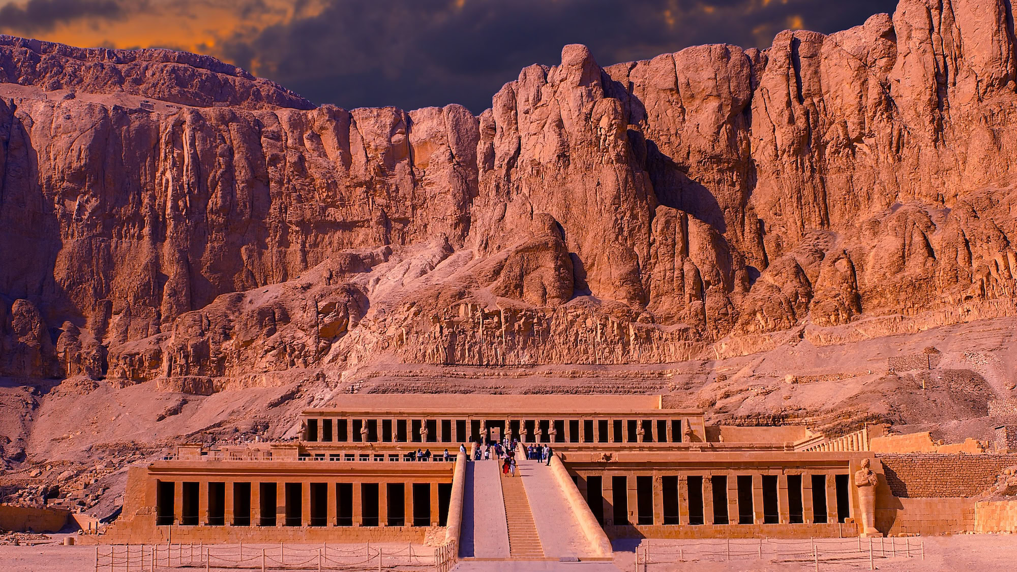 Mortuary Temple of Hatshepsut carved into limestone cliffs with terraced columns and stairs