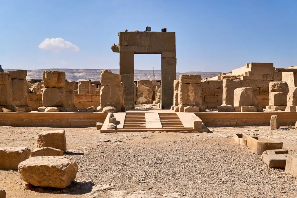 Temple of Ramesses II showing stone pylons, carved reliefs, and courtyard columns at Abydos