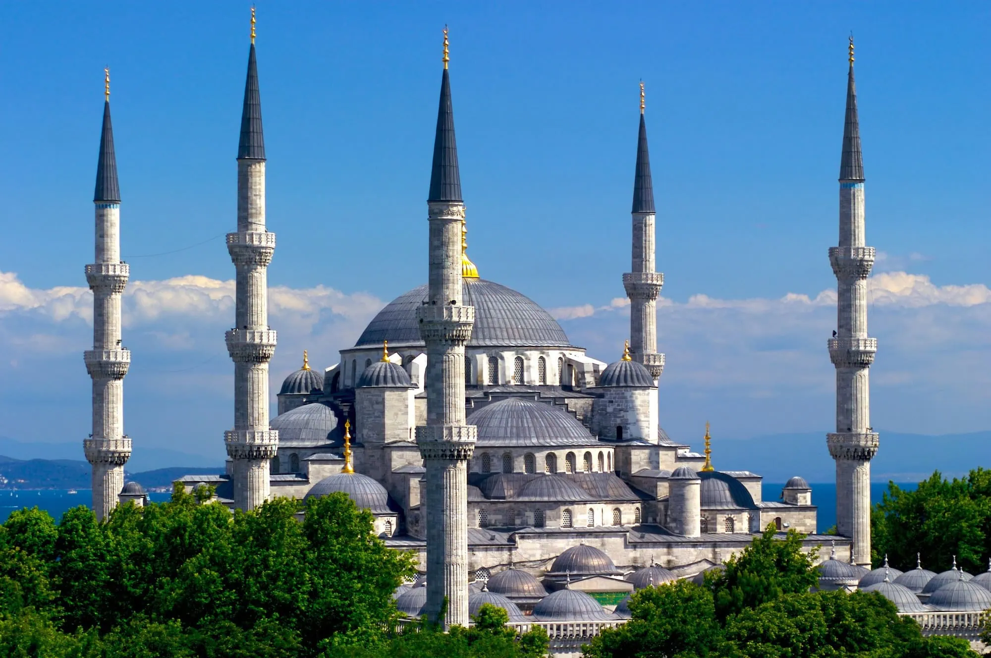 Blue Mosque with six elegant minarets and multiple domes against cloudy sky