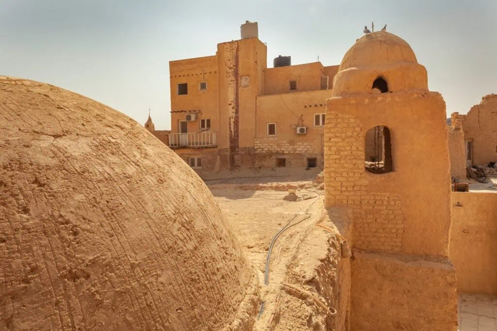 The Monastery of Saint Paul the Anchorite with the church dome and tower in the foreground near Zaafarana, Red Sea Governorate