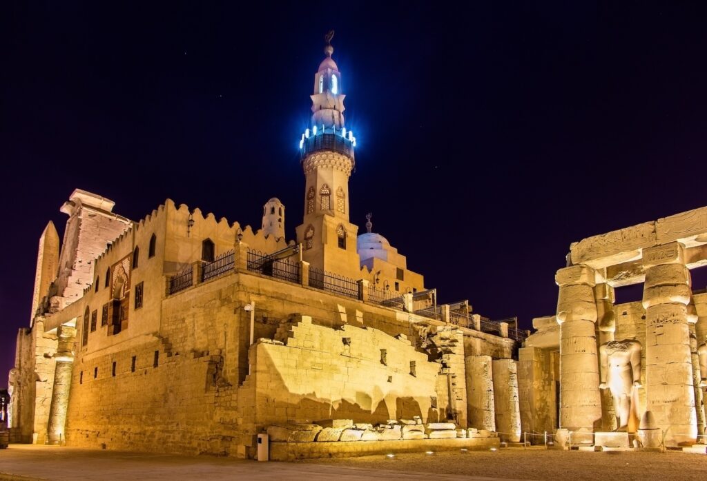 Exterior view of the Mosque of Abu Haggag illuminated in evening light within the Luxor Temple complex, Luxor