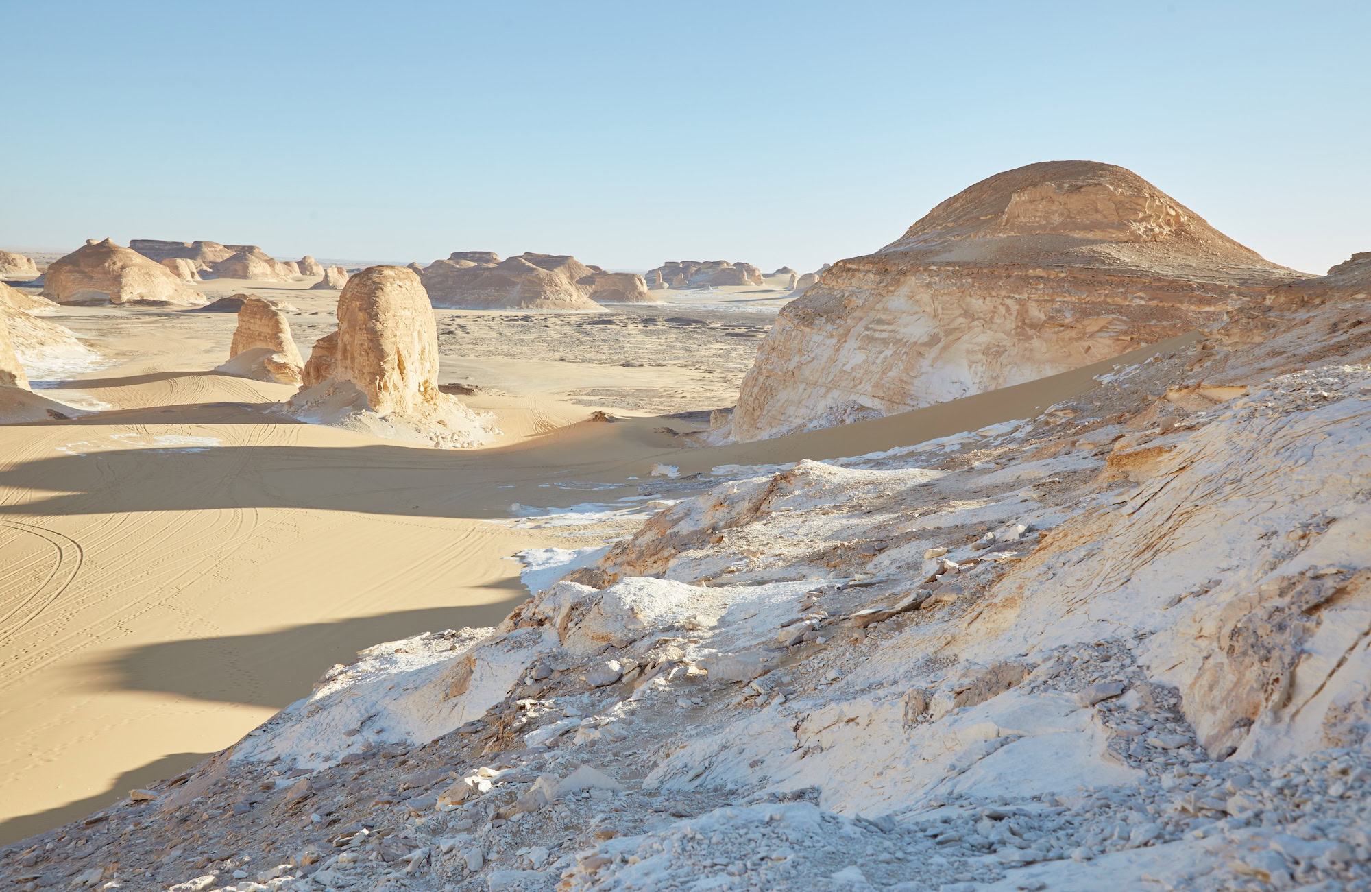 White chalk formations and limestone pillars in Egypt's White Desert landscape