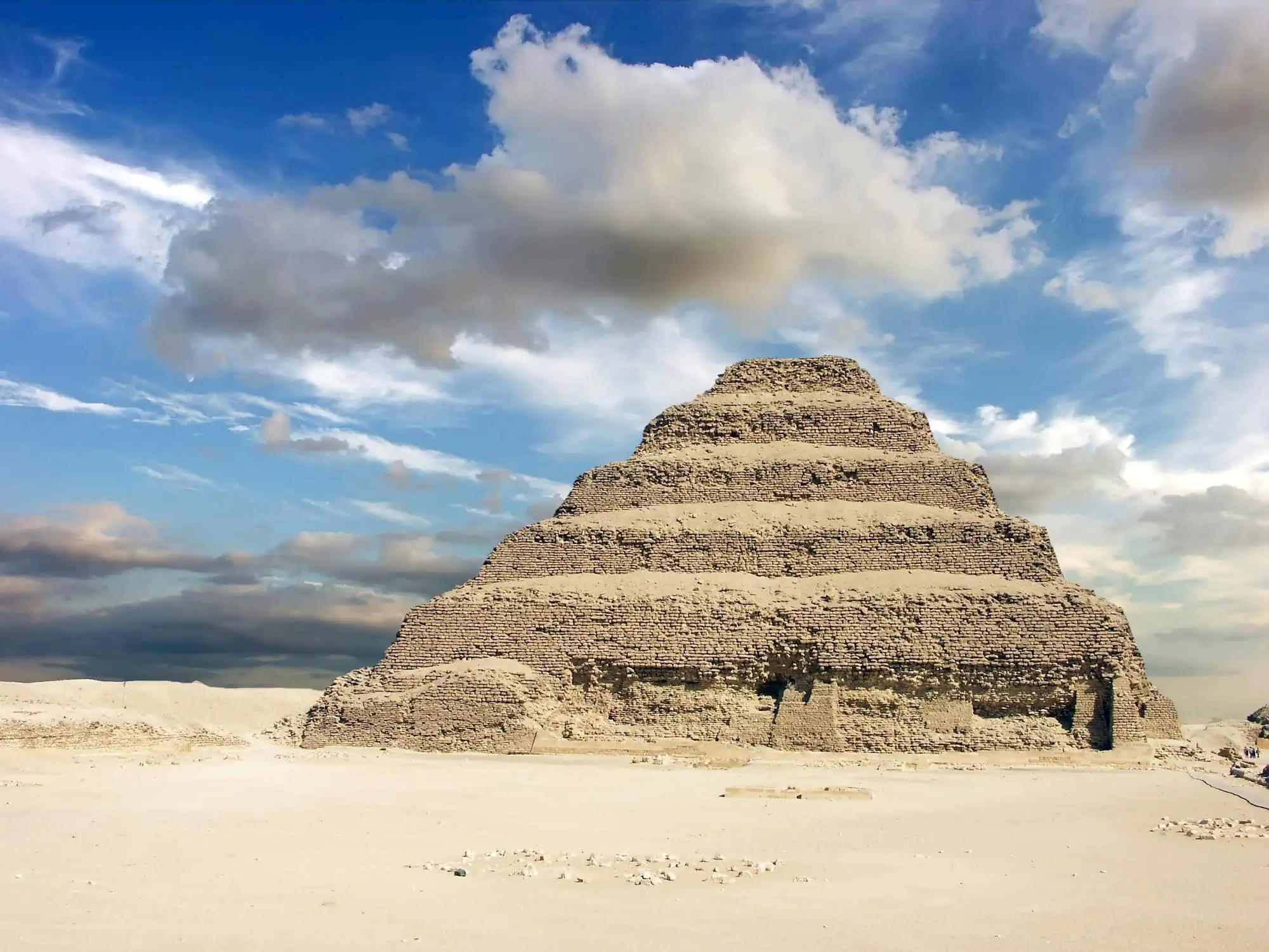 The six-stepped Pyramid of Djoser rising above the desert plateau at Saqqara, south of Cairo