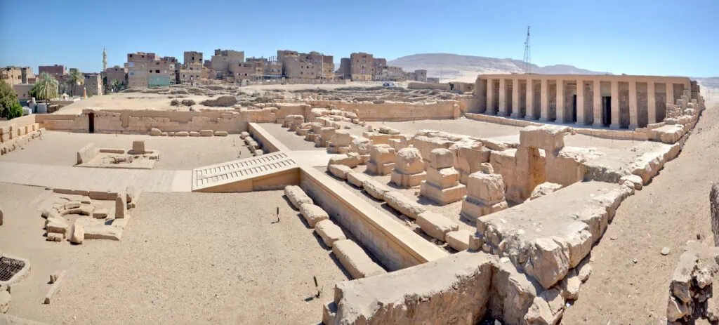 Panoramic view of the stone walls and open courtyards of the Temple of Seti I and the Temple of Ramses II at Abydos in Middle Egypt