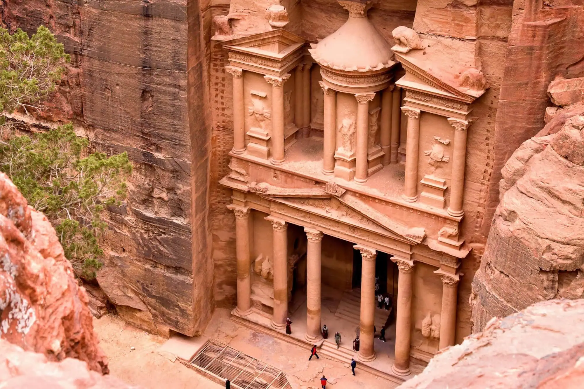The famous Treasury facade carved into pink sandstone at Petra, Jordan